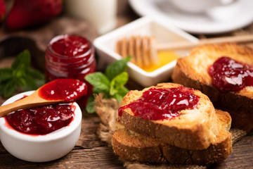 Fresh strawberry jam with bread for breakfast