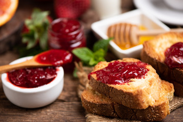Fresh strawberry jam with bread for breakfast