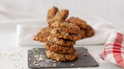 OAT AND BANANA COOKIES ON A WHITE BACKGROUND