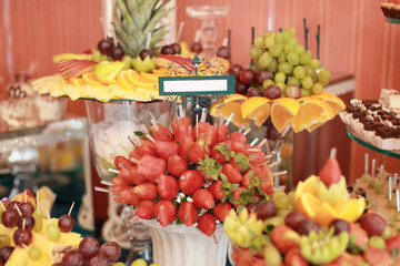 Obraz na płótnie Canvas Candy bar on wedding ceremony with a lot of different candies and beverages