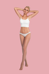 Young, slim, healthy and beautiful blonde woman in white lingerie. Sport, fitness, diet, weight loss and healthcare concept. Mockup.