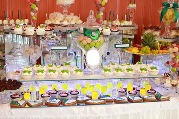 Candy bar on wedding ceremony with a lot of different candies and beverages