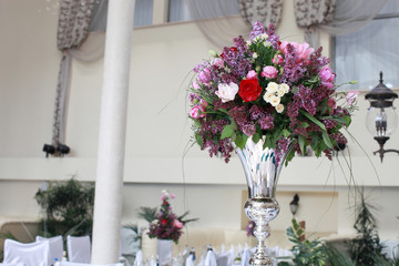 Very beautiful ceremony. classical wedding . The arch is wooden. White flowers.Rite. Bride and groom. Decor. Floristics.
