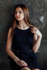 Fototapeta premium beautiful girl posing in the Studio and looking at the camera