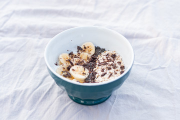 YOGURT BALL WITH BANANA OAT AND CHOCOLATE ON A WHITE BACKGROUND