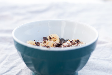 YOGURT BALL WITH BANANA OAT AND CHOCOLATE ON A WHITE BACKGROUND