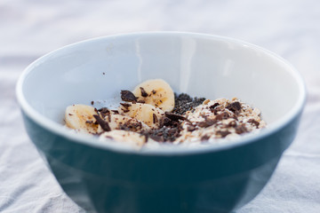 YOGURT BALL WITH BANANA OAT AND CHOCOLATE ON A WHITE BACKGROUND