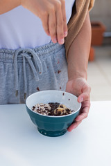 YOGURT BALL WITH BANANA OAT AND CHOCOLATE ON A WHITE BACKGROUND