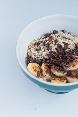 YOGURT BALL WITH BANANA OAT AND CHOCOLATE ON A WHITE BACKGROUND