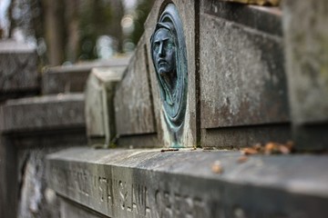 tombstone with engraving of a woman