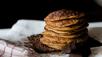 OAT CAKES WITH CHOCOLATE ON A BLACK BACKGROUND