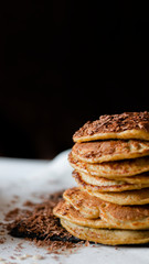 OAT CAKES WITH CHOCOLATE ON A BLACK BACKGROUND