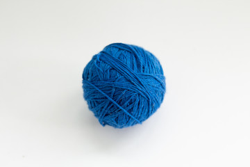 blue ball of thread on a white background