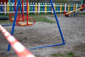 Warning sign of quarantine with red stripe. Closed kids playgrounds. Coronavirus, Covid-19 outbreak.