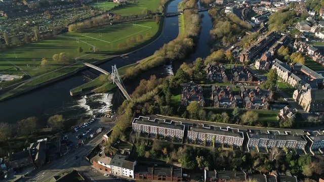 Aerial panorama of Exeter city outskirts looking across the river and the exwick estate including the park and playing fields