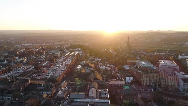 Glorious sunset over Exeter city.  Aerial reveals amazing landscape and the guildhall shopping centre and rooftop car park