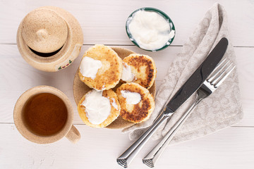Group of four whole cheese pancake on white wood