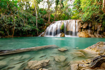 Fototapeta na wymiar Beautiful flowing waterfall in the forest