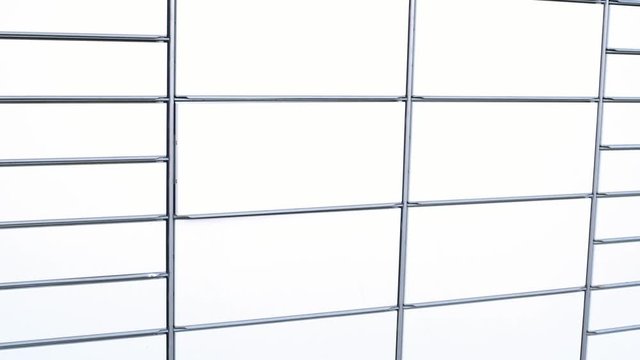 courier in protective gloves inserting placing package in box in parcel locker