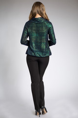 Beautiful blonde model posing in green shirt and black pants