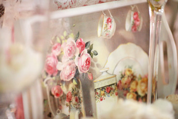 Wedding. Banquet. The chairs and round table for guests, served with cutlery, flowers and crockery and covered with a tablecloth