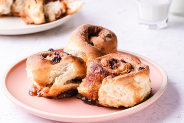 Cinnamon buns   in plate on morning table