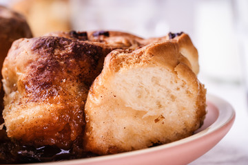 Cinnamon buns   in plate on morning table
