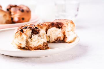 Freshly baked cinnamon buns on morning table