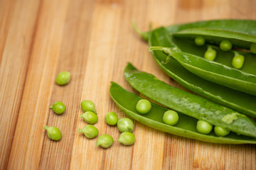 macro view of opened pods with green peas