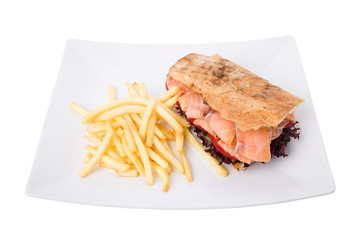 Sandwich salmon with tomato and french fries.