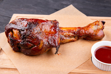 Pig roll baked on grill with crispy crust is served with ketchup