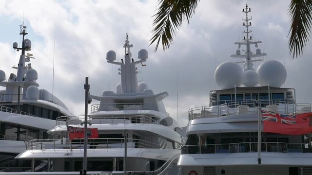 Luxury boats yacht stalling on Barceloneta's port during sunny and cloudy summertime day