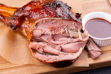Pig roll baked on grill with crispy crust is served with ketchup