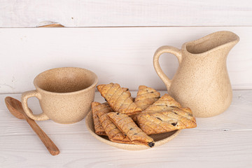 Lot of whole square puff cookie with raisins breakfast on white wood