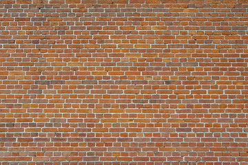 Brick wall of red brick in an old house.