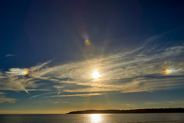 Image of St Aubins Bay with shunshine and Noirmont point in the background. Jersey Channel Islands