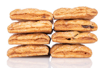 Group of eight whole square puff cookie with raisins isolated on white