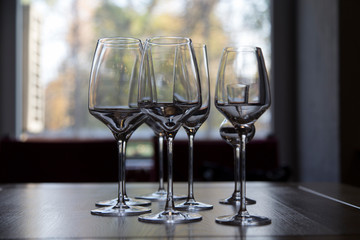 The row of wine glasses on a sill.
