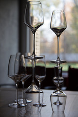 The row of wine glasses on a sill.