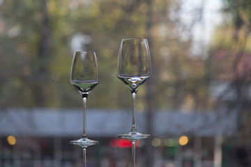 The row of wine glasses on a sill.