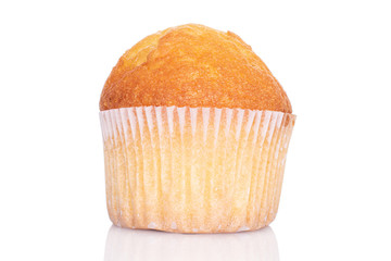 One whole small baked muffin closeup isolated on white