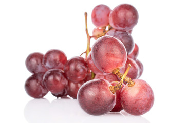Lot of whole fresh red globe grape isolated on white