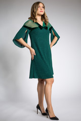 Beautiful girl posing in green dress