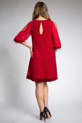 Beautiful blonde girl posing in red fashion dress