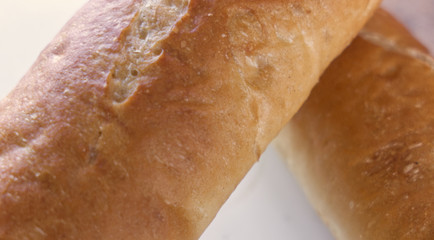 Fresh bread, french baton, tiger bread and small baguettes close up, with shallow depth of focus