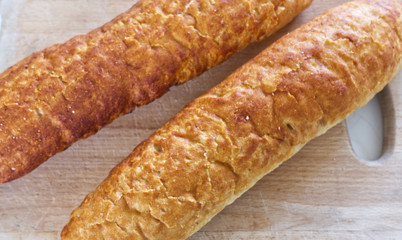 Fresh bread, french baton, tiger bread and small baguettes close up, with shallow depth of focus