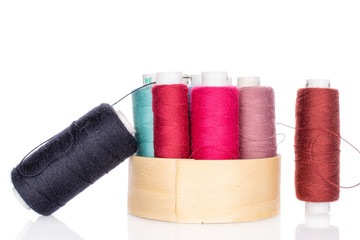 Lot of whole thread spools in bamboo isolated on white