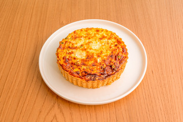 vegetable quiche plate on wooden table