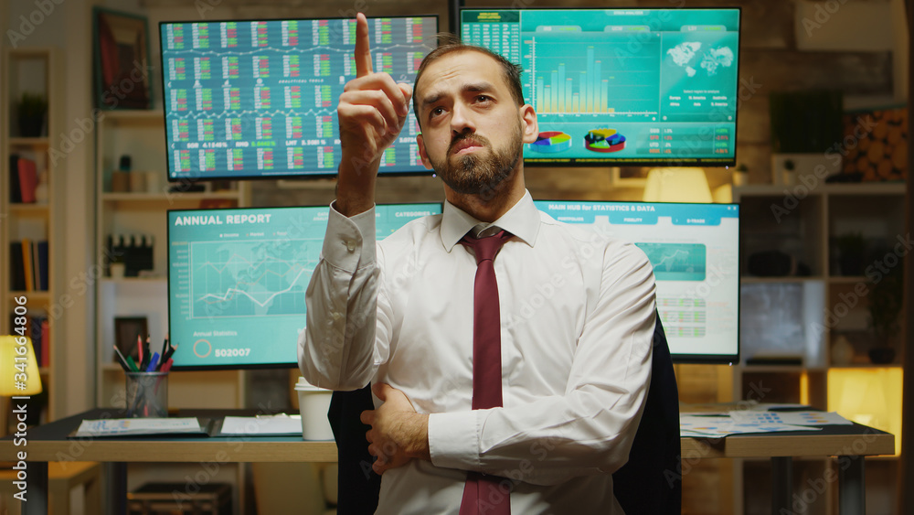 Poster male stock market trader pointing while using augmented reality