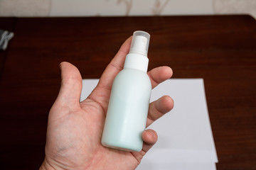 Antiseptic sprayer in the hand. Ready-to-use disinfectant